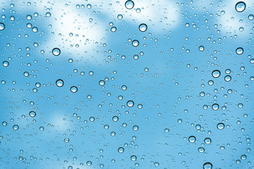 Rain on the window, natural skin of the rain The natural form of rainwater on a sky background.