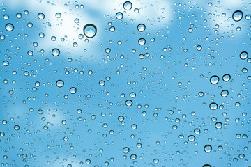 Rain on the window, natural skin of the rain The natural form of rainwater on a sky background.