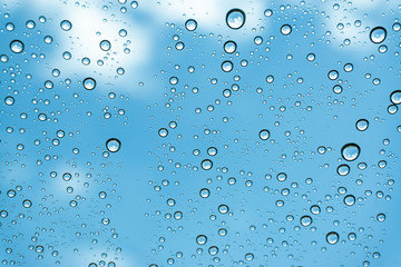 Rain on the window, natural skin of the rain The natural form of rainwater on a sky background.