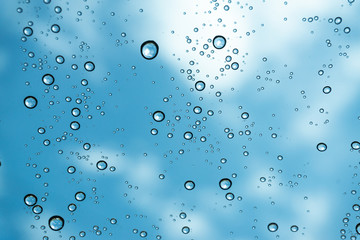 Rain on the window, natural skin of the rain The natural form of rainwater on a sky background.