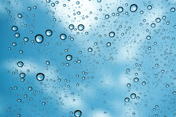 Rain on the window, natural skin of the rain The natural form of rainwater on a sky background.