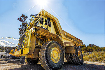 Obraz premium Enormous dumper truck under harsh sun - digital artwork