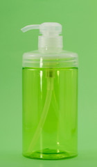 Empty Shampoo Pump Bottle isolated on green