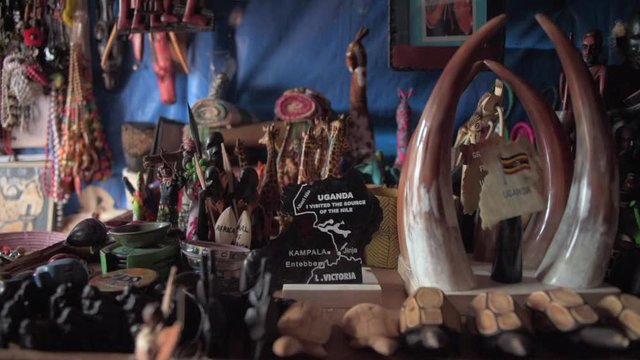 A shop sells wooden toys and souvenirs on the Nile River in Jinja, Uganda.