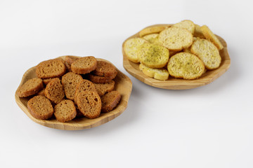wood plate of crusty bread bruschetta on white background