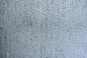 Texture of a concrete wall with cracks and scratches which can be used as a background