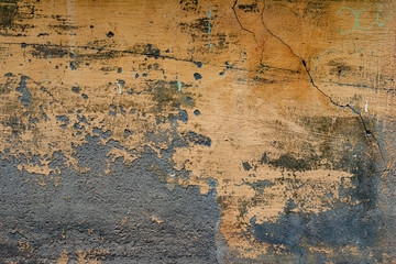 Texture of a concrete wall with cracks and scratches which can be used as a background