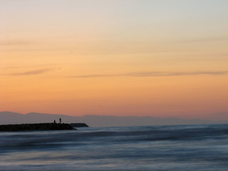 Fototapeta premium Sunset sky abstract background. Yellow sunset sky over the sea. Golden time of sky at sunset - sunrise time in summer season. Warm color sky yellow. White space for text.