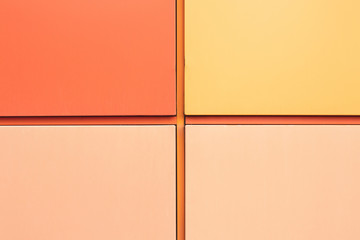 Abstract geometric background for design. Texture of the wall in orange tones, divided into 4 sectors. 