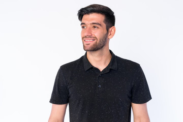 Obraz premium Face of happy young bearded Persian man thinking