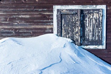 Old winter window of the mountain hut
