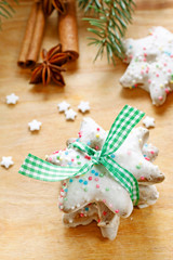 Christmas cookies in star shape on wooden table.