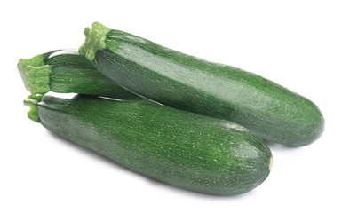Fresh ripe green zucchinis isolated on white