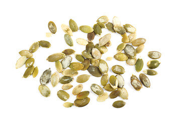 Raw pumpkin seeds on white background, top view