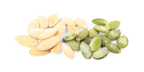 Pile of raw pumpkin seeds on white background, top view