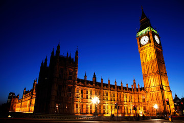 Fototapeta na wymiar Night view of Westminster Palace over dramatic blue sky