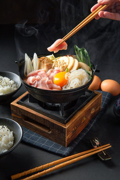 Japanese hotpot buta akakara nabe with pork rice set . In lighting studio