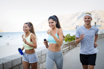 Friends fitness training together outdoors living active healthy