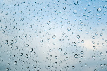 Glass texture with water drops in blue tones