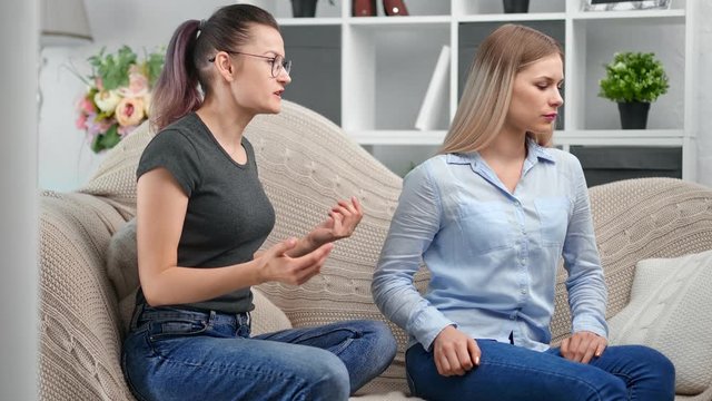 Angry aggressive hipster lesbian female shouting girlfriend gesturing and abusing feeling negative