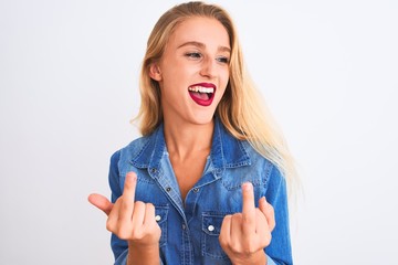 Young beautiful woman wearing casual denim shirt standing over isolated white background Showing...