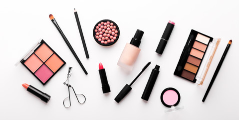 Assortment of luxury cosmetics for every day makeup on white