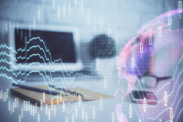 Forex Chart hologram on table with computer background. Multi exposure. Concept of financial markets.