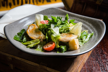 Caesar salad with fresh lettuce, parmesan and fried croutons.