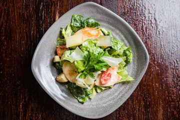 Caesar salad with fresh lettuce, parmesan and fried croutons.
