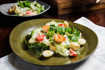 Caesar salad with fresh lettuce, parmesan and fried croutons.