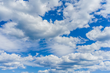 Blue sky on a sunny day with fluffy clouds