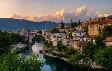 Fototapeta na wymiar Skyline of Mostar with the Mostar Bridge against the beautiful evening sky