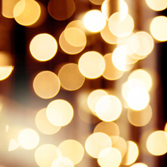 Abstract golden background, bokeh christmas party lights.