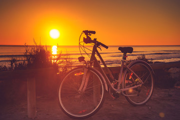 Fototapeta na wymiar Bicycle on beach, active lifestyle.