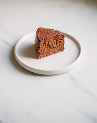 vegetarian chocolate cake. sugar-free, milk-free dessert on marble background with copy space