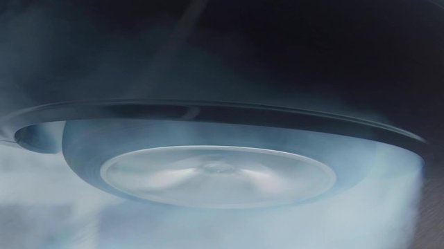 A Dodge Challenger speeding and burning rubber in a parking lot 2.