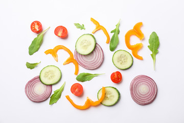 Fresh vegetables slices on white background, top view