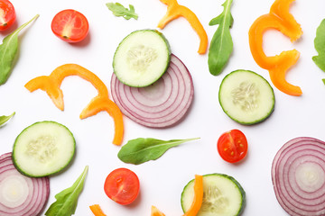 Fresh vegetables slices on white background, top view