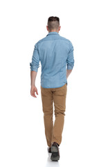 casual man walking lonely on his path