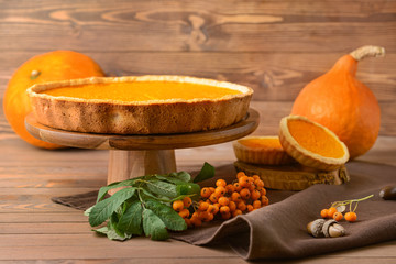 Tasty pumpkin pie on wooden table
