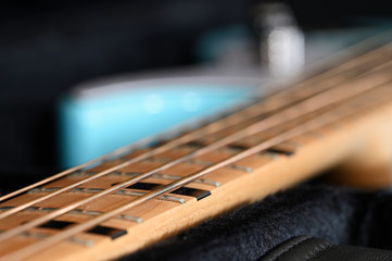 Fototapeta premium Strings of bass guitar and frets in detail.