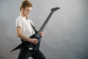 Fototapeta premium Man playing on electric guitar