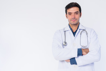 Fototapeta premium Portrait of young Persian man doctor with arms crossed
