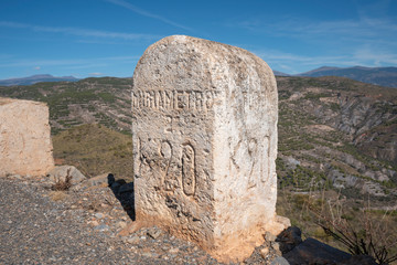 a kilometer milestone on the Turon road (Spain)