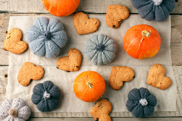 Pumpkin Cookies. Delicious pumpkin heart shaped cookies with an autumn harvest background, seasonal homemade bakery, cozy home, handmade sweetness