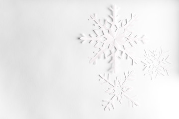 white background with paper snowflakes