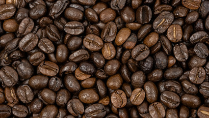 Roasted coffee beans background, Close Up mixture of different kinds of coffee beans.