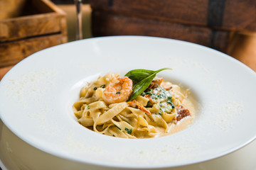 Pasta in cream sauce, Italian dinner with wine