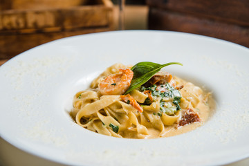 Pasta in cream sauce, Italian dinner with wine