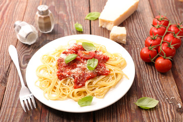 spaghetti with tomato sauce, basil and parmesan